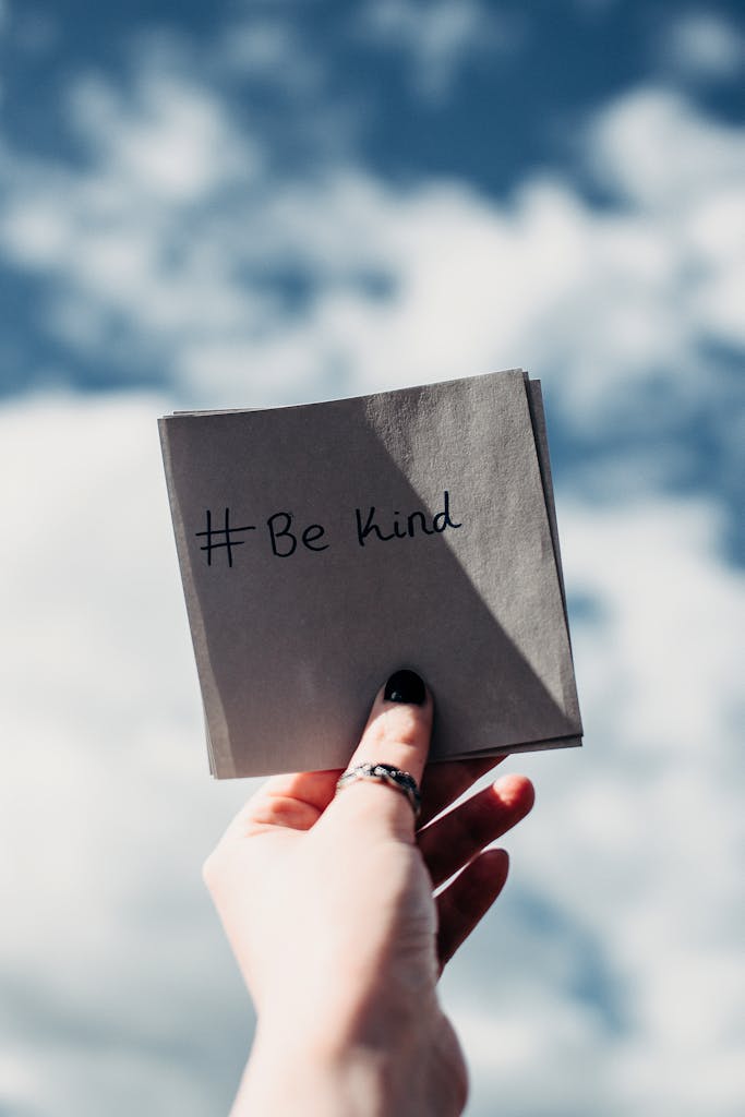 Person Holding Note with Be Kind Text - Embrace Your Unique Self